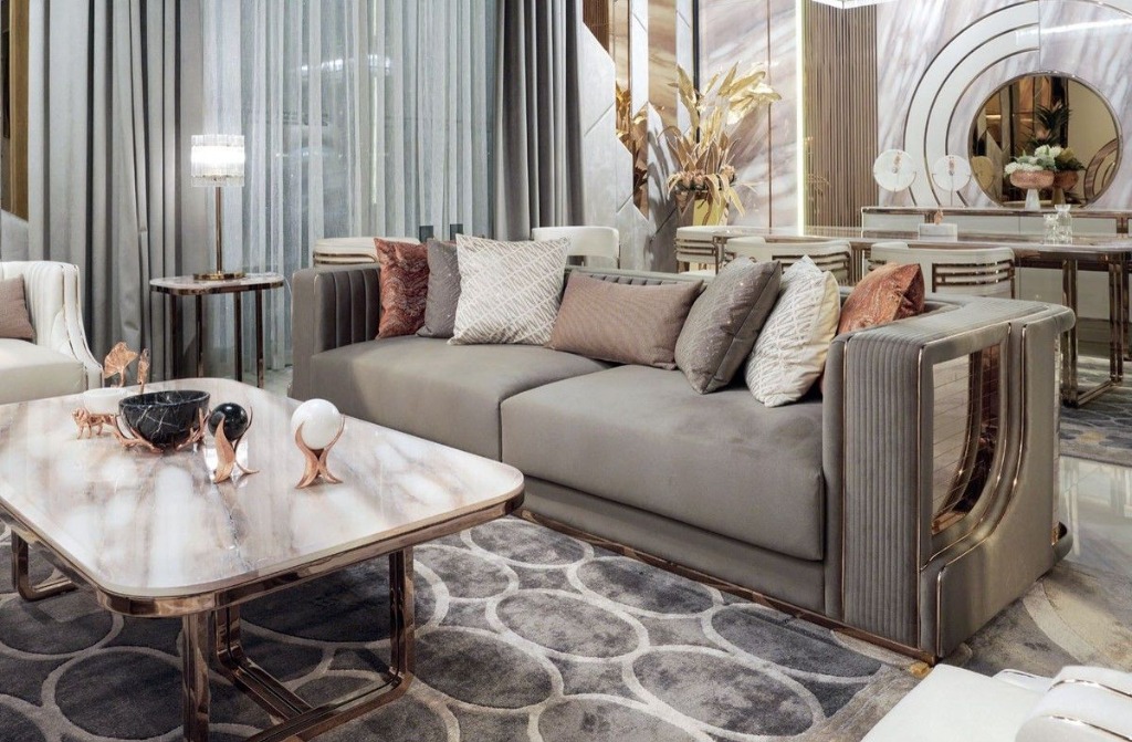 Luxury living room with rose gold accents and marble coffee table
