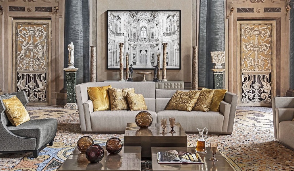 Palatial living room with golden cushions and mosaic flooring